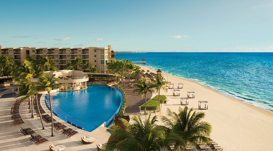 Dreams Riviera Cancun Resort and Spa family-friendly all-inclusive resort in Puerto Morelos with pools, beach, and lush tropical gardens.