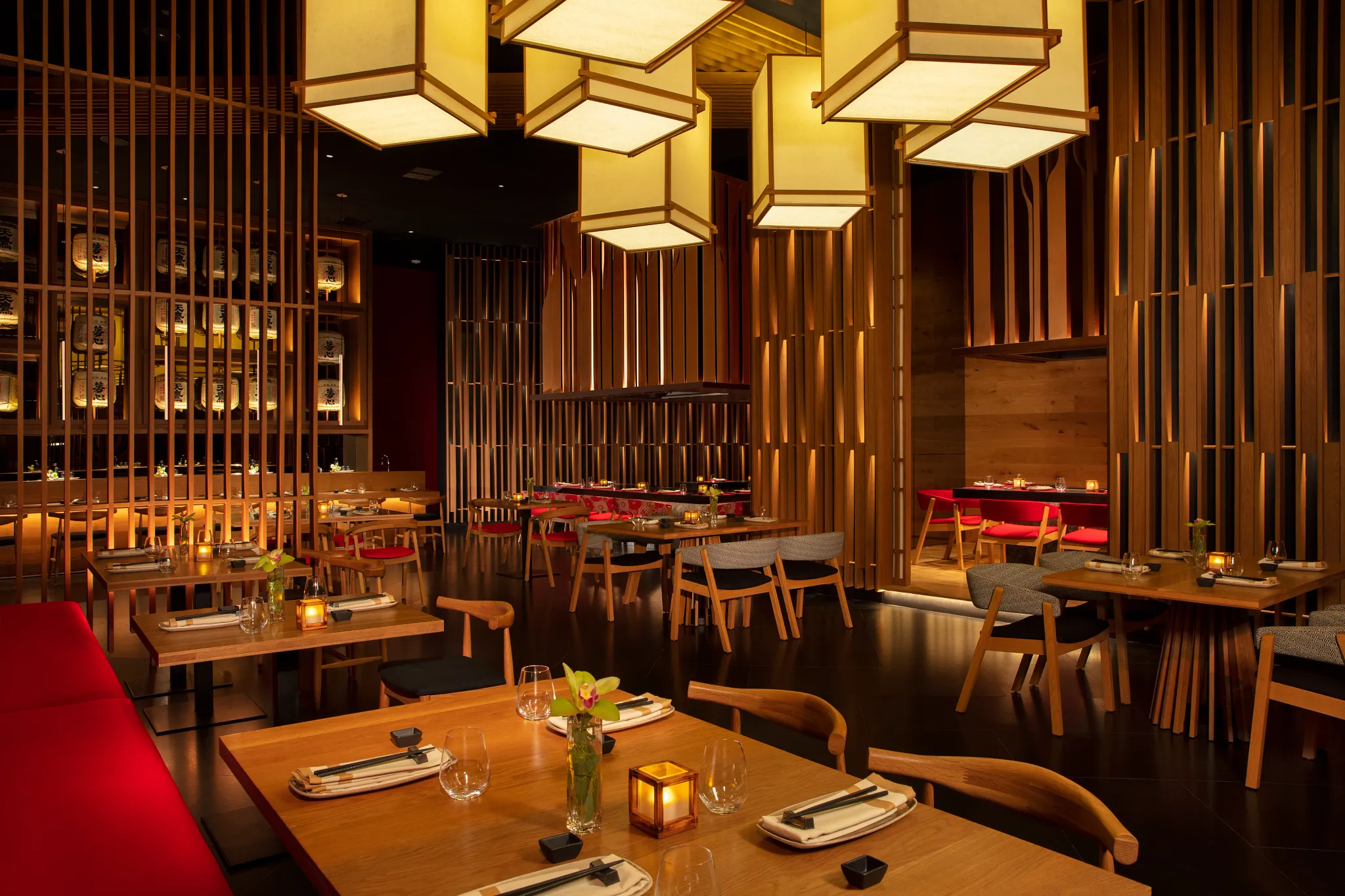 Elegant dining room at Himitsu Pan-Asian restaurant with sushi bar and teppanyaki tables at Secrets Maroma Beach Riviera Cancun.