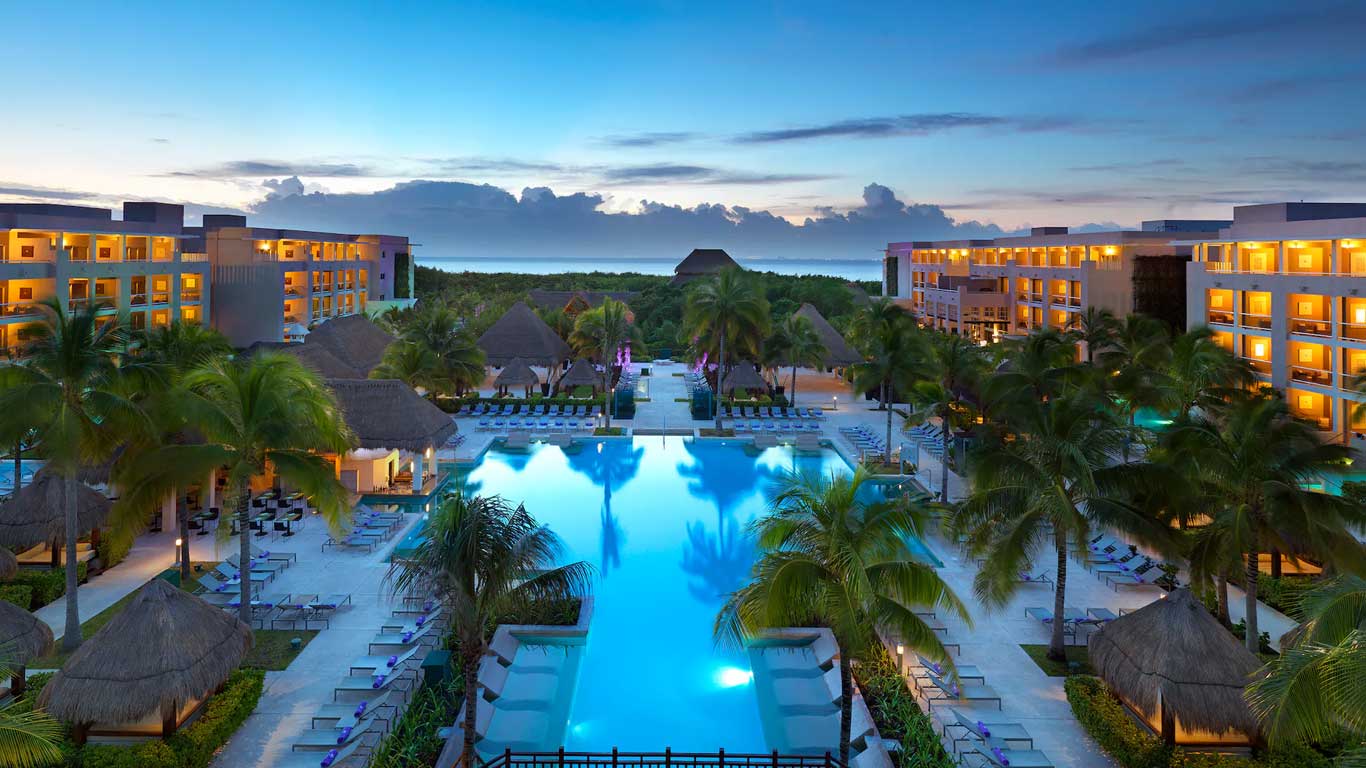 Paradisus Playa del Carmen adults-only all-inclusive resort with modern architecture, beachfront pools, and walkable access to Fifth Avenue.