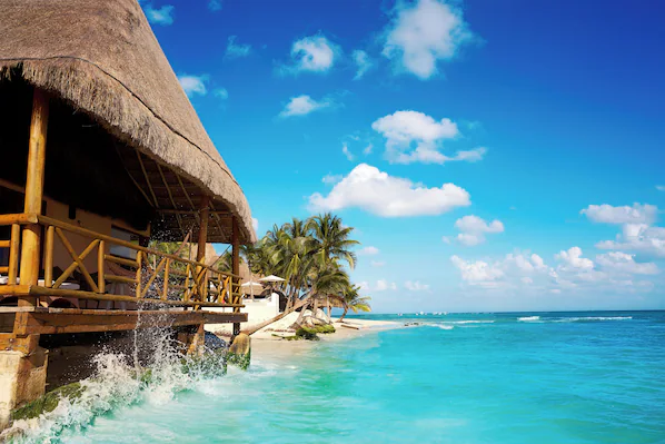 Playa del Carmen Main Beach near Secrets Maroma Beach Riviera Cancun with turquoise Caribbean water and palm-lined shoreline