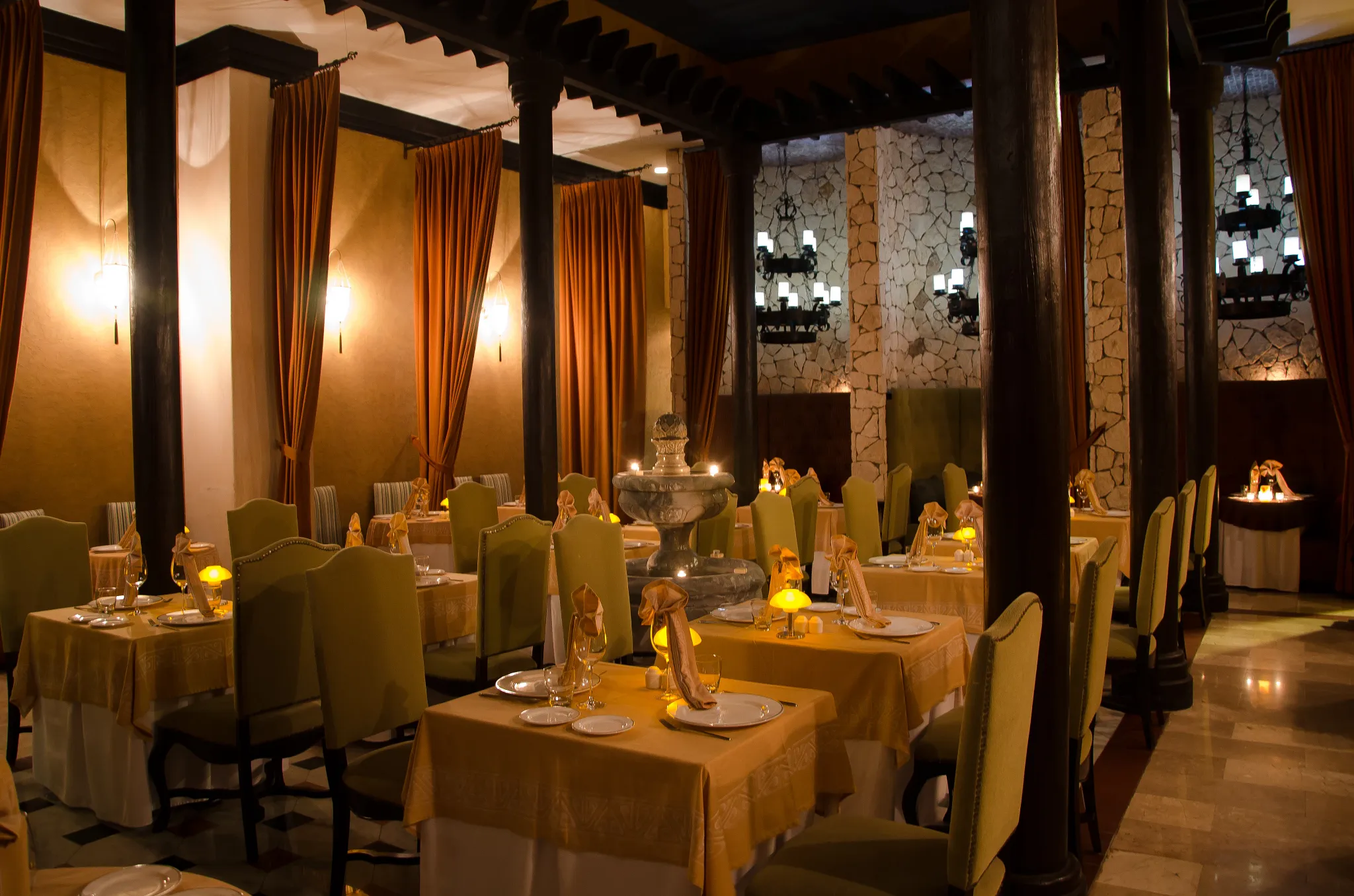 Romantic candlelit dining room at Portofino Italian restaurant at Secrets Maroma Beach Riviera Cancun.