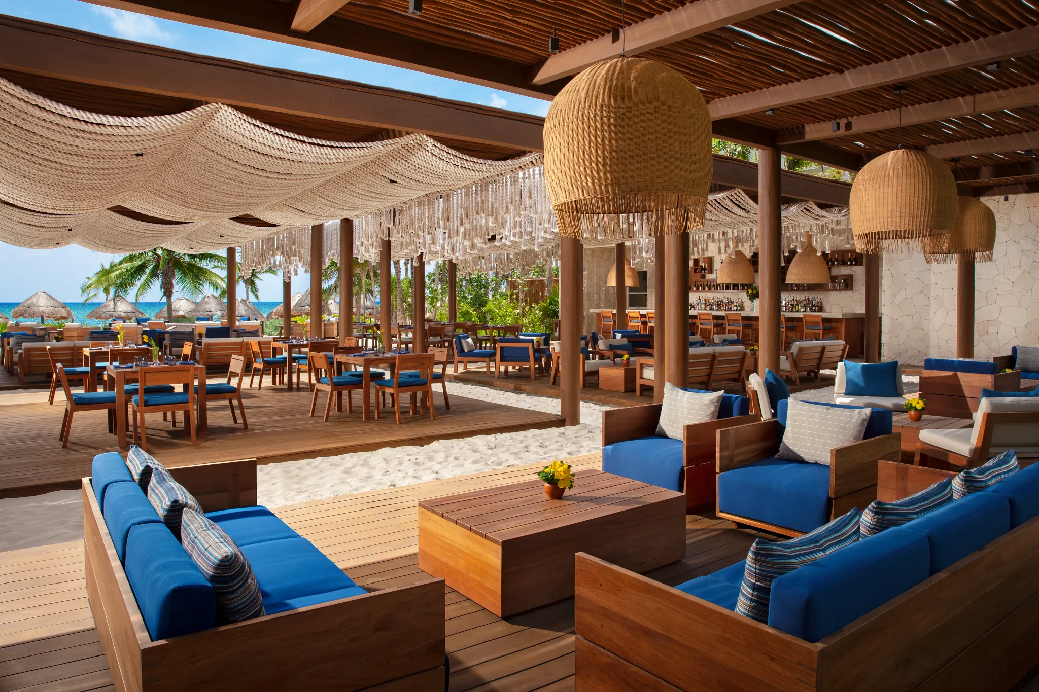 Preferred Beach Club oceanfront lounge area with cabanas and seating at Secrets Maroma Beach Riviera Cancun.