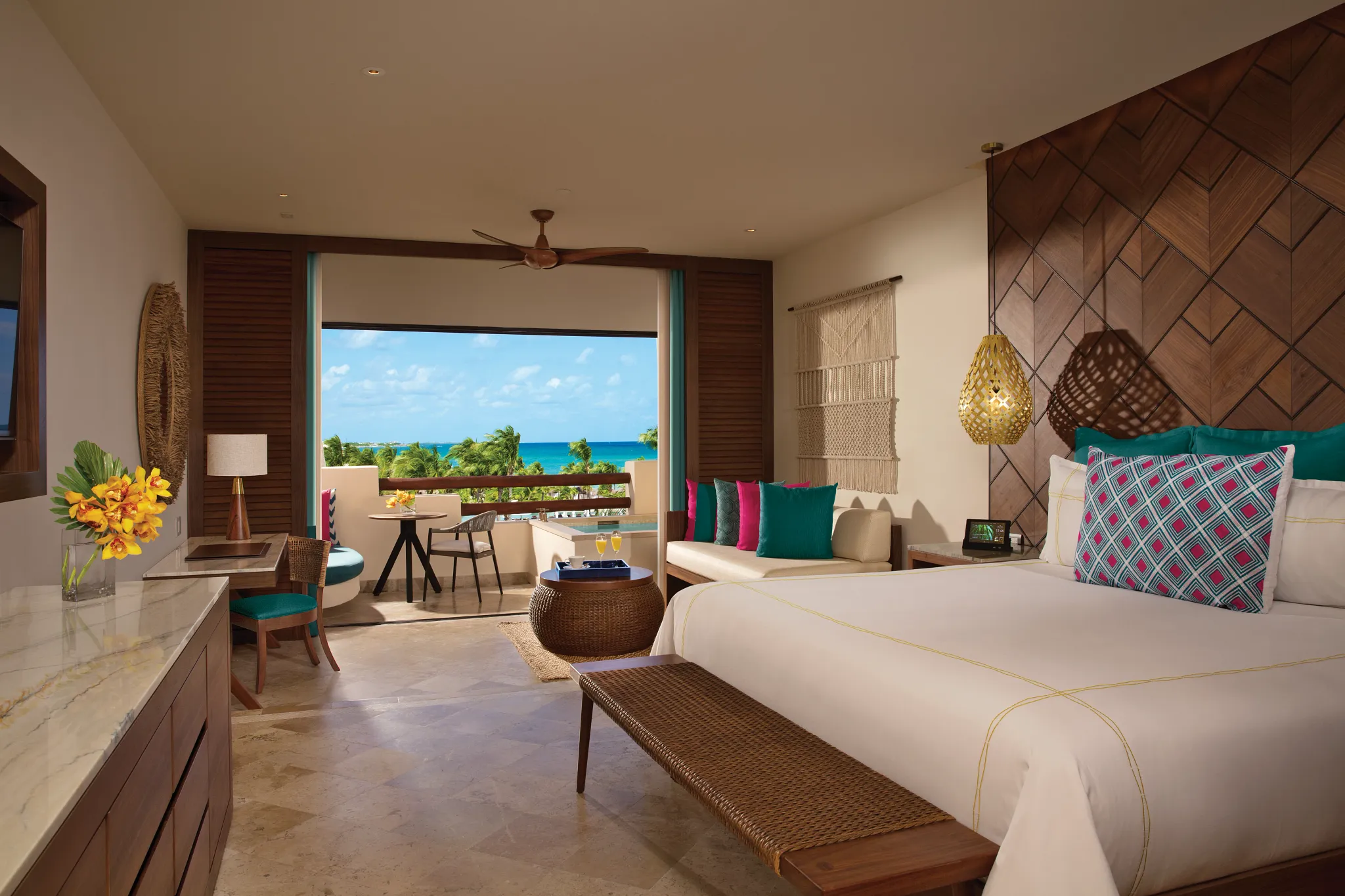 Preferred Club Junior Suite Ocean View interior with balcony overlooking the Caribbean at Secrets Maroma Beach Riviera Cancun.