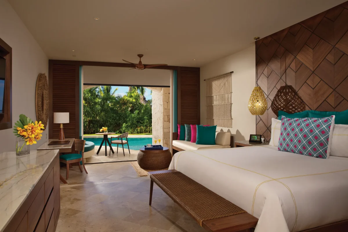 Preferred Club Junior Suite Swim Out with king bed and terrace access at Secrets Maroma Beach Riviera Cancun.
