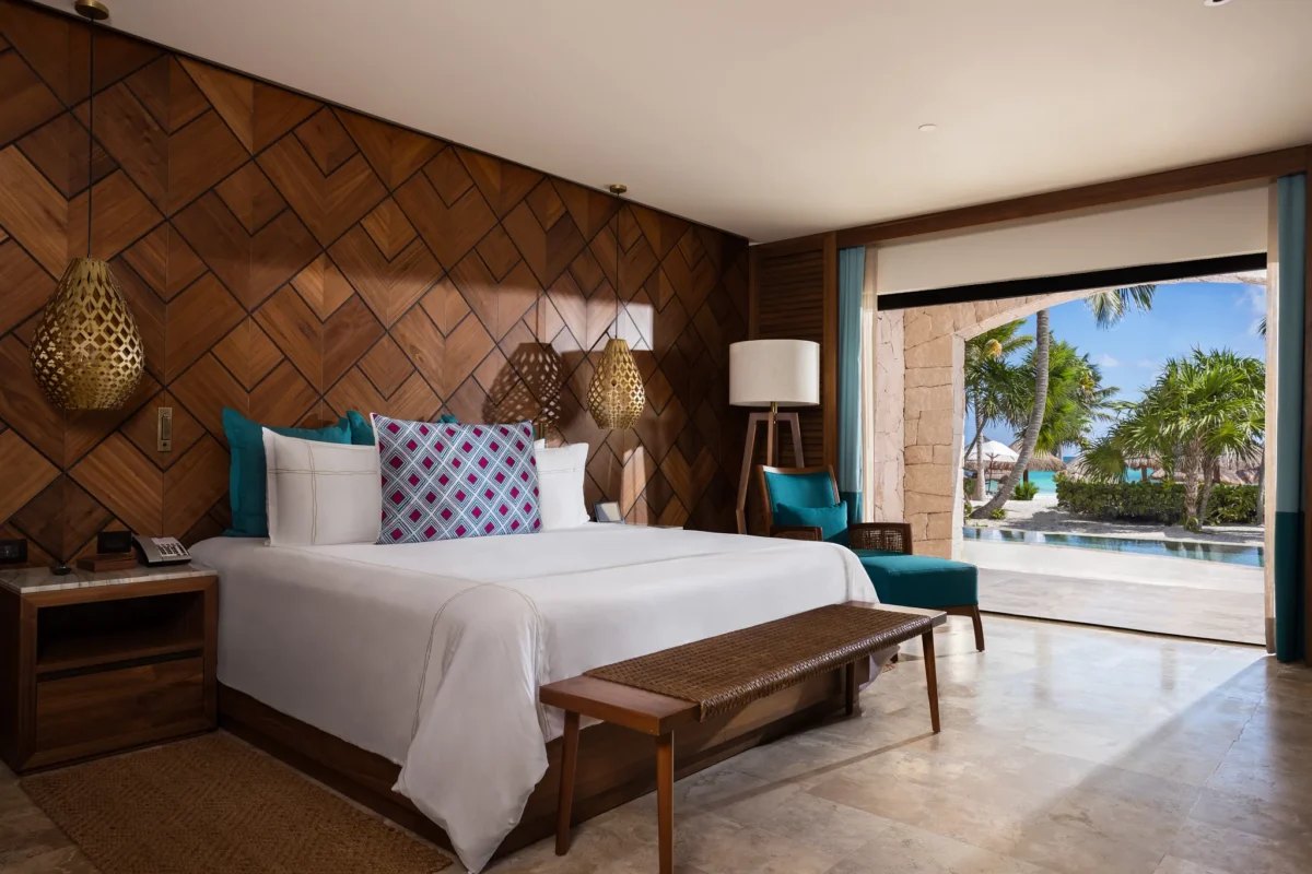 Preferred Club Ocean Front Swim Out Governor Suite king bedroom at Secrets Maroma Beach Riviera Cancun.