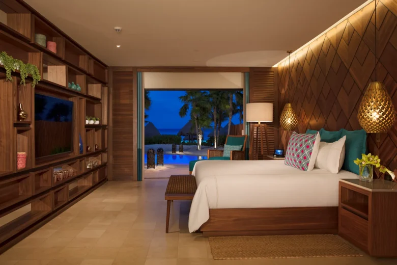 Presidential Suite Swim Out king bedroom at Secrets Maroma Beach Riviera Cancun with oceanfront view.