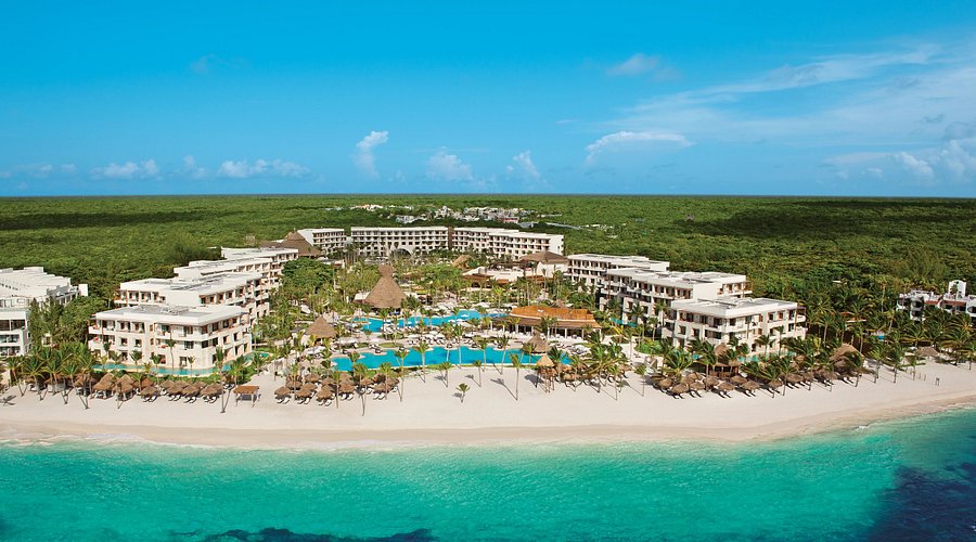 Secrets Akumal Riviera Maya adults-only all-inclusive resort with beachfront pools, lush jungle surroundings, and sea turtle snorkeling nearby.