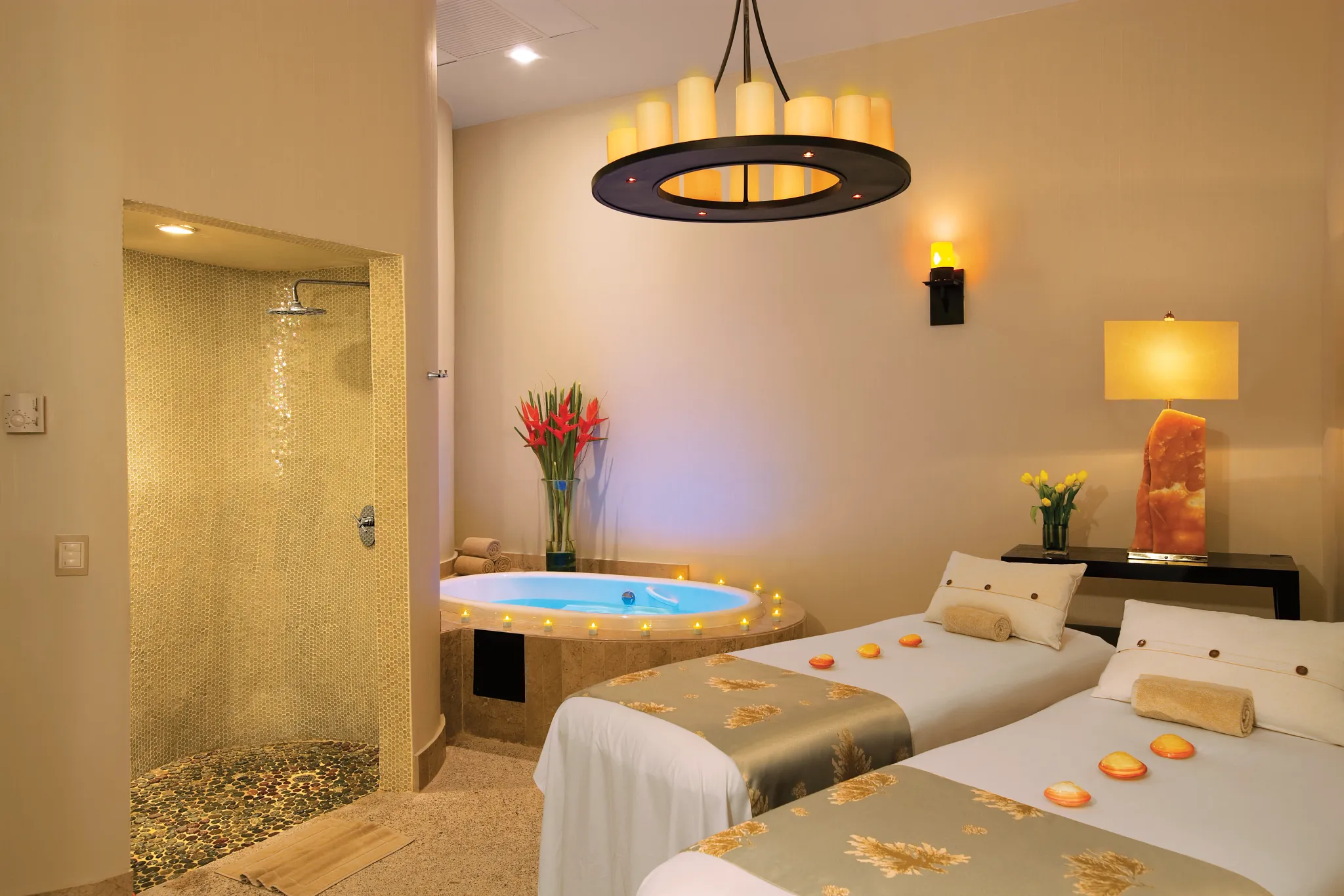 Private spa suite with hydrotherapy tub and twin massage tables at Secrets Maroma Beach Riviera Cancun.