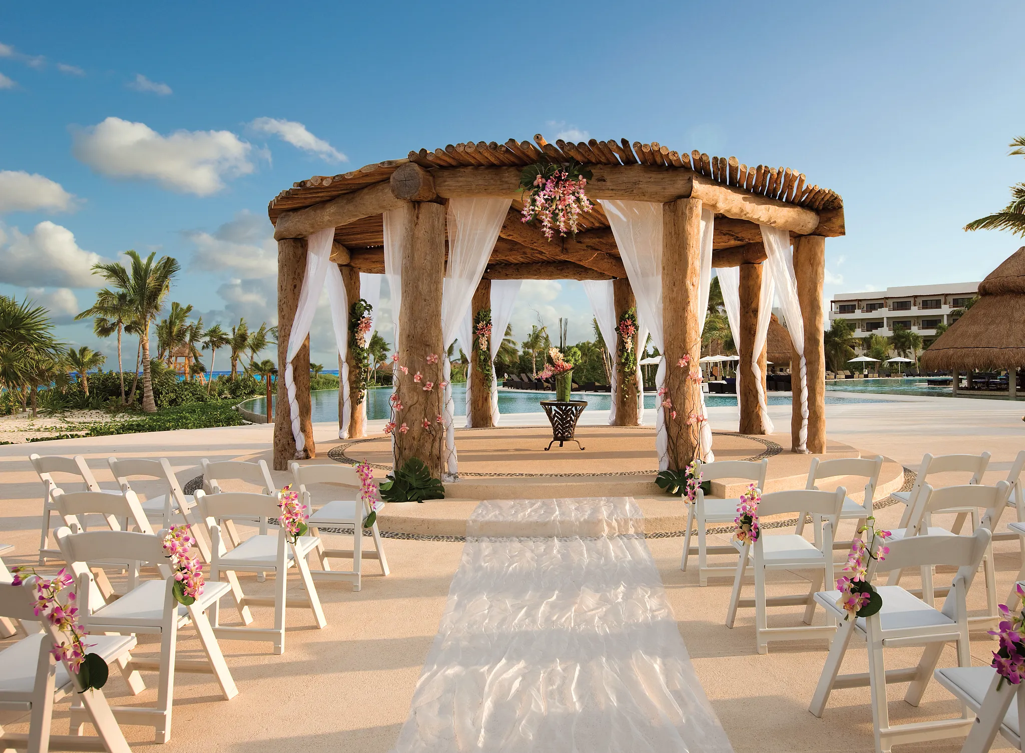 Oceanfront wedding gazebo ceremony setup at Secrets Maroma Beach Riviera Cancun